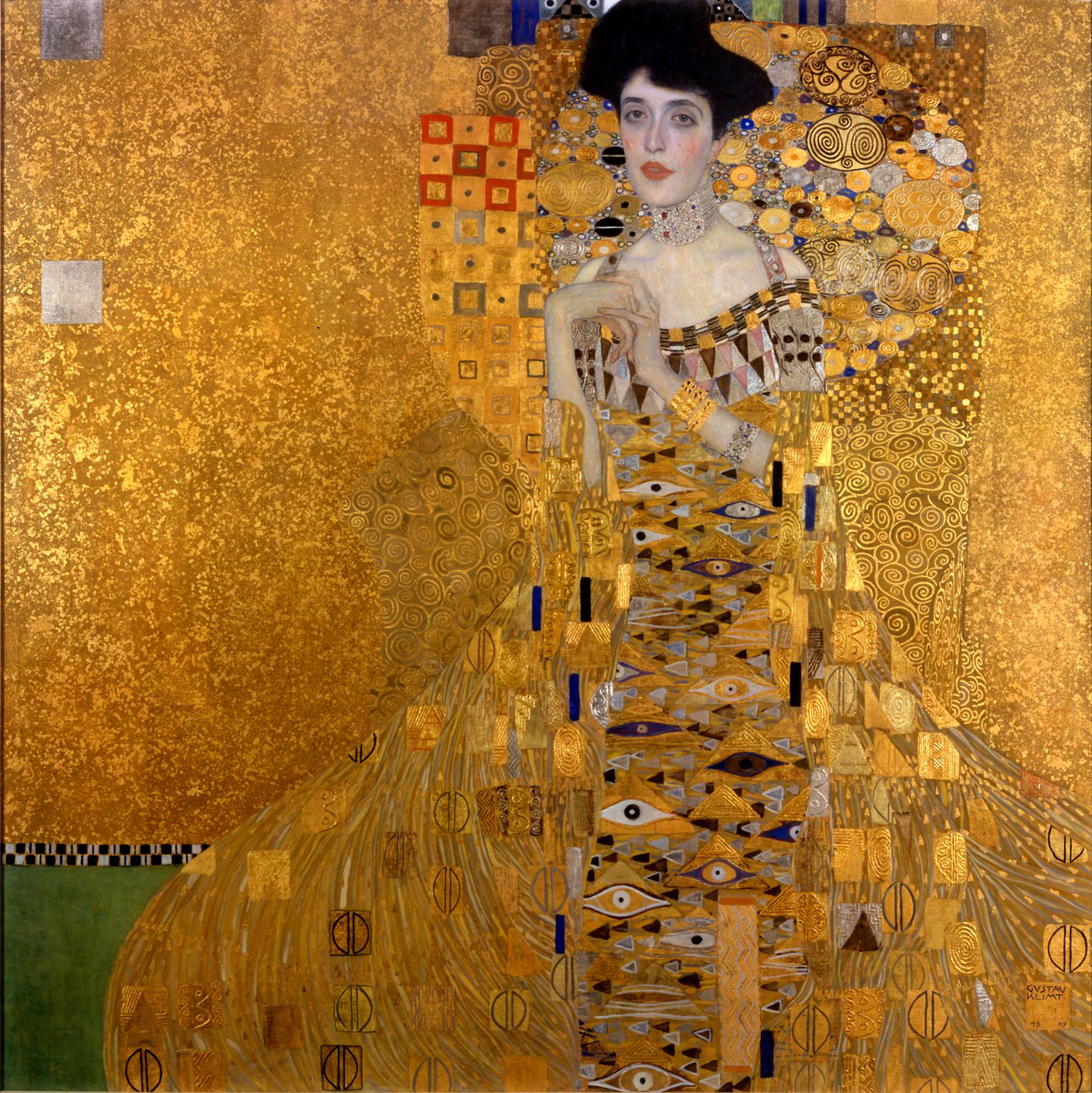Art Nouveau oil painting Adele Bloch-Bauer I by Gustav Klimt, featuring a woman in an elaborate gold dress filled with geometric symbols, eyes, and triangles against a shimmering gold background.