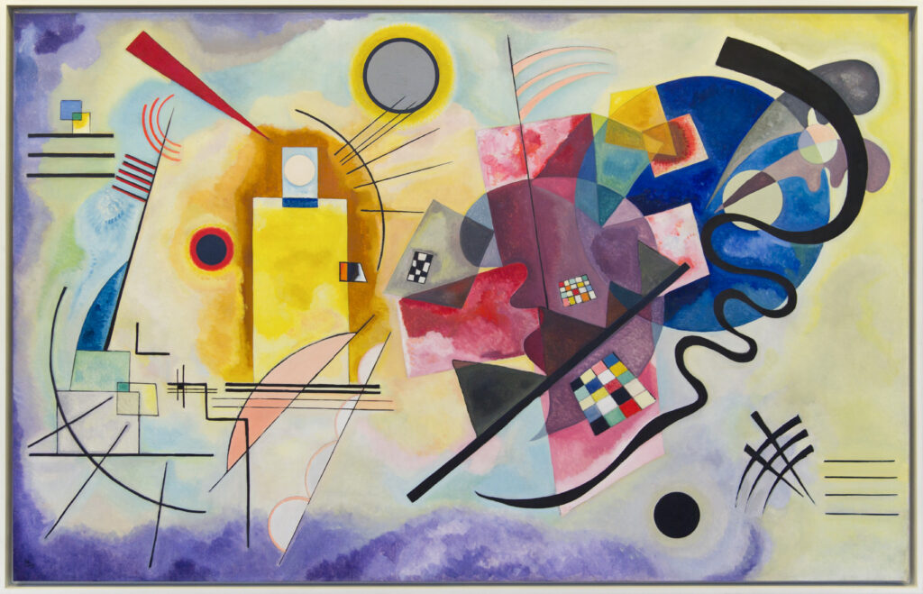 Abstract oil painting Yellow-Red-Blue by Wassily Kandinsky. The artwork features vibrant yellow, red, and blue shapes with black lines, circles, and checkerboard patterns on a multi-colored background.