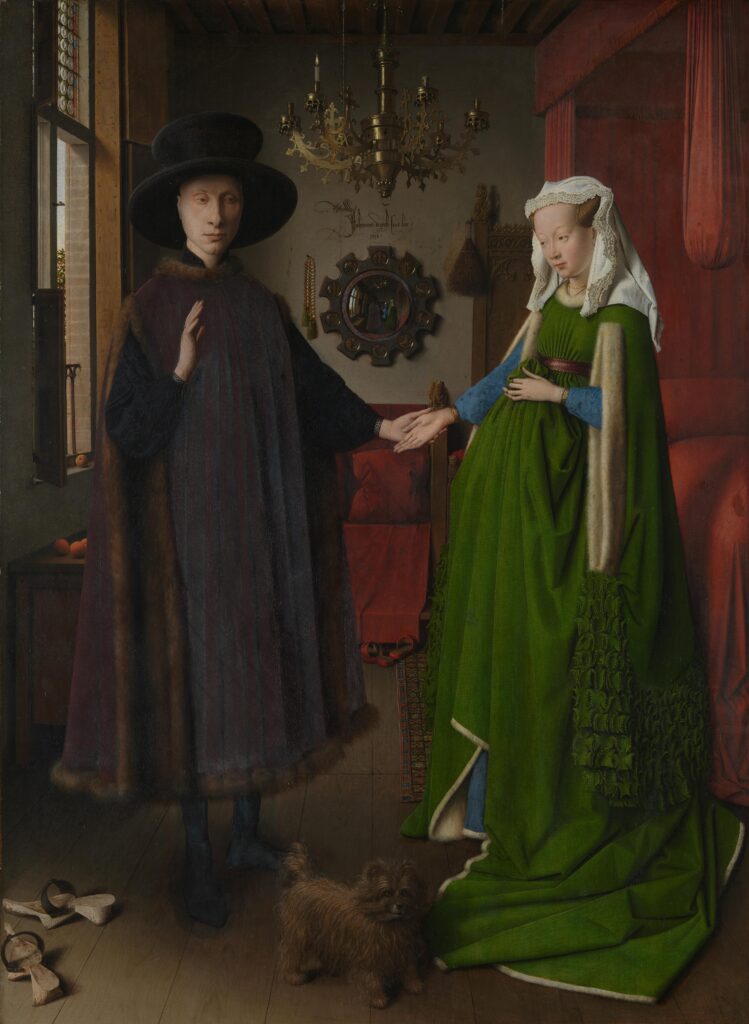 Renaissance oil painting by Jan van Eyck showing a man in a dark fur-trimmed robe and a woman in a heavy green dress holding hands in a richly detailed room with a mirror and chandelier.